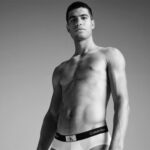 Carlos Alcaraz serves in Calvin Klein’s latest body-baring campaign