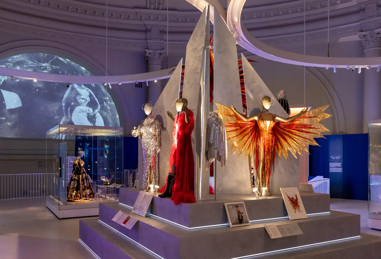 Tina Turner’s famous flame dress (right) was designed by Bob Mackie (V&A/PA)
